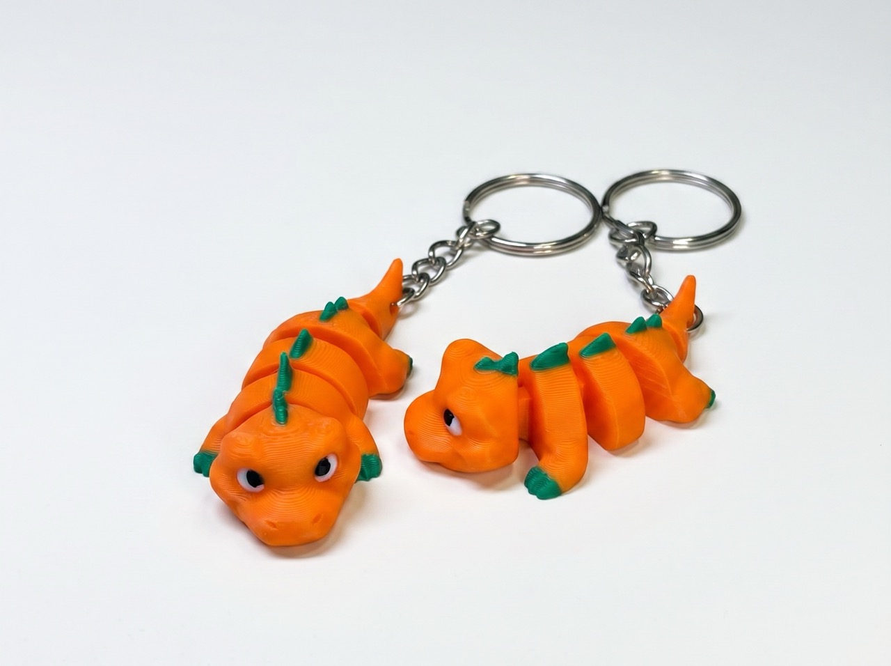Brelok 3D Dinozaur pomarańczowy